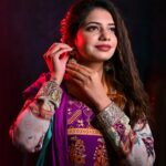 Portrait of a woman in colorful Indian attire, showcasing elegance and grace.